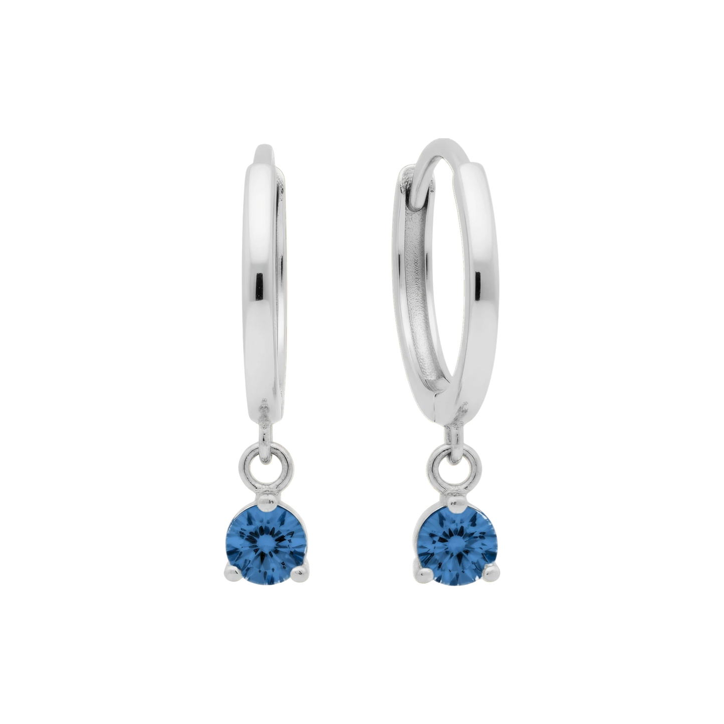 Qutahia Jewelry 14k solid gold dangling huggie earrings with blue zircon gemstone in a claw setting.
