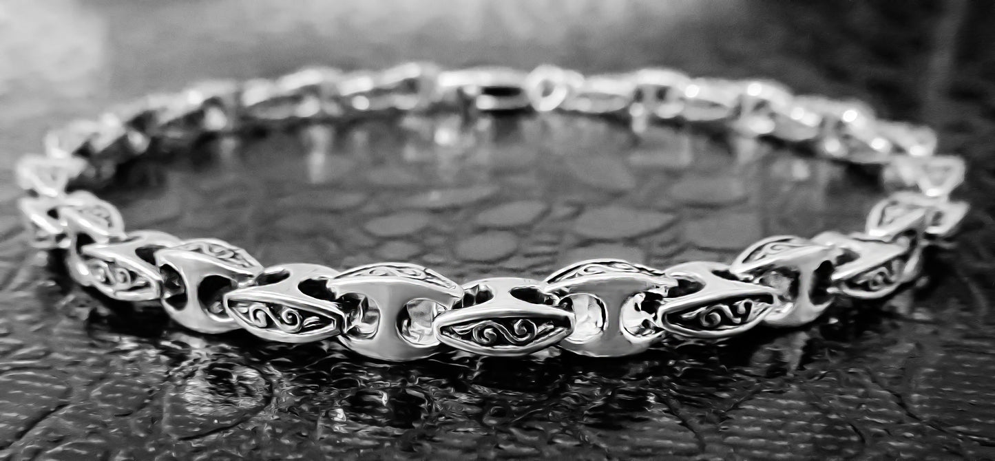 Detailed close-up of an oxidized gents silver bracelet by Qutahia Jewellery.
