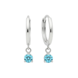 Qutahia Jewelry 14k solid gold dangling huggie earrings with round blue gemstone in claw setting.