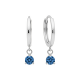 Qutahia Jewelry 14k solid gold dangling huggie earrings with blue zircon gemstone in a claw setting.