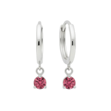 Qutahia Jewelry 14k solid gold dangling huggie earrings with pink gemstones in a claw setting.