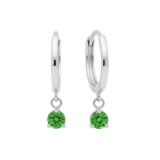 Qutahia Jewelry 14k solid gold huggie earrings with dangling green gemstone in claw setting.